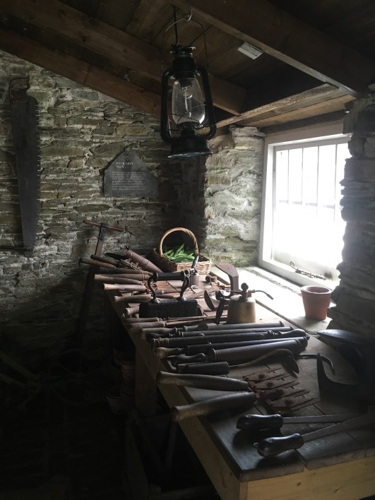 Garden shed and vintage garden tools at The Lost Gardens of Heligan, Cornwall, England